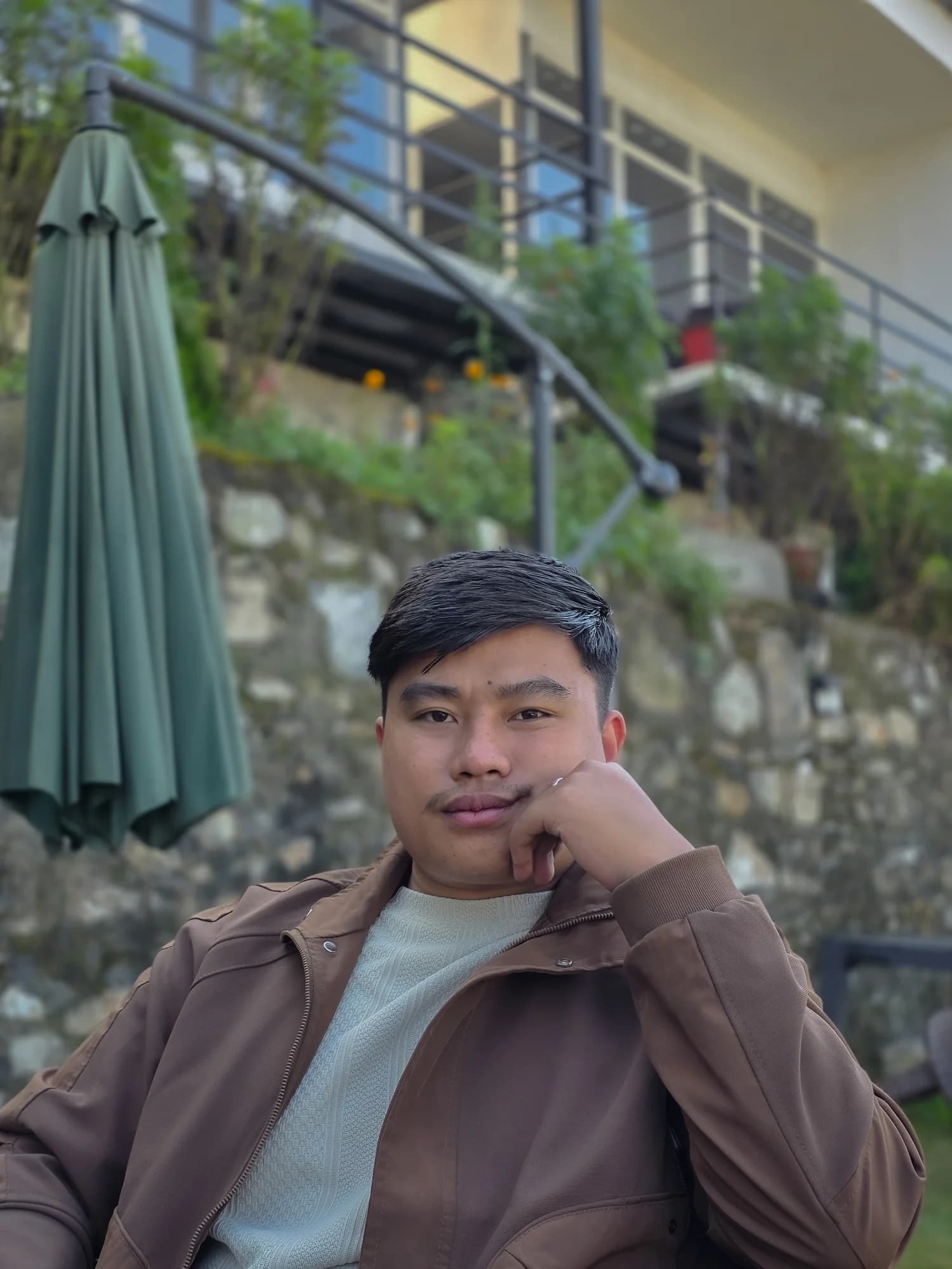Sandeep Thapa Magar seated outdoors